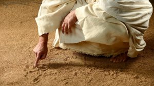 What was Jesus writing in the sand?