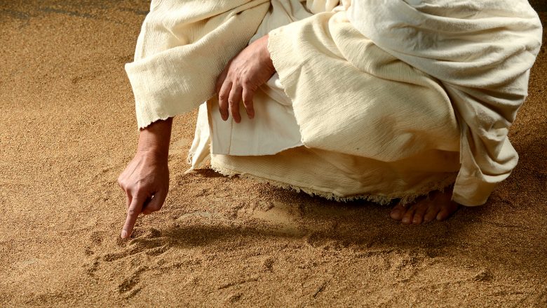 What was Jesus writing in the sand?